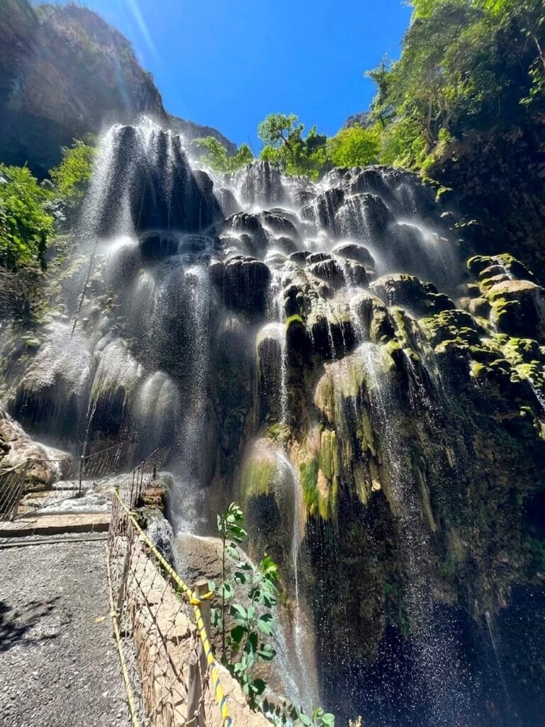 The turquoise travertine hot spring waterfalls at Grutas de Tolantongo, Hidalgo, Mexico